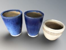 A pair of earthenware plant pots,