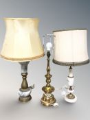 Two marble and brass mounted table lamps and a further all brass lamp,