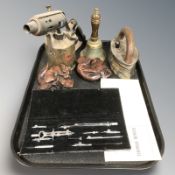 A vintage blow lamp, bell, iron, a precision drawing set, two carvings.