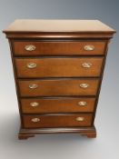 A reproduction five drawer chest,