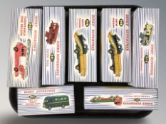 A group of reproduction Dinky die cast scale vehicles including fire engine, horse box, snow plough,