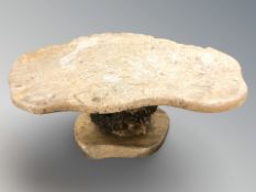 A rustic burr wood coffee table,