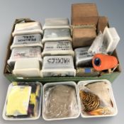 A large quantity of craft feathers, spool of thread, etc.