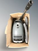 A Miele vacuum cleaner.