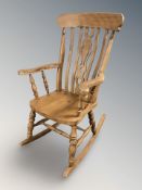 A scumbled pine rocking chair.