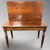 A 19th century mahogany turnover top tea table,
