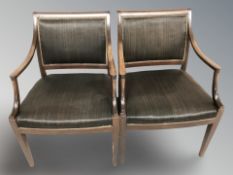 A pair of continental mahogany salon armchairs, width 57 cm.