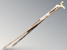 A group of silver mounted walking sticks and canes,