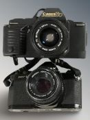 A Canon T70 camera with Canon zoom lens FD35-70mm,