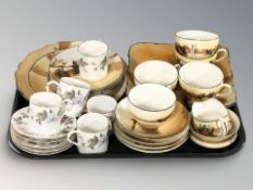 A Royal Worcester June Garland part coffee service and a Royal Doulton part tea service decorated