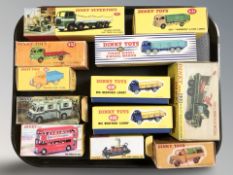 A group of reproduction Dinky die cast scale haulage wagons, delivery vans, Routemaster bus, etc,