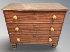 A Victorian satin wood three drawer chest,
