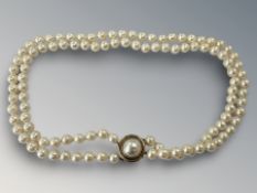 A good quality double strand pearl necklace on 18ct yellow gold clasp set with a mabe pearl,