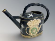 A hand painted Toleware watering can, height 33 cm.