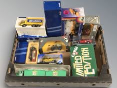 A group of Corgi and other boxed die cast scale model vehicles, delivery vans, etc.
