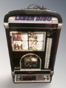 A Laser Disc coin-operated CD jukebox, 62 cm W x 34 cm D x 100 cm H.