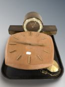 A teak Junghans wall clock, with pendulum, no weights, and a further mantel clock signed 'Amigo'.