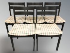A set of five continental ebonised dining chairs.
