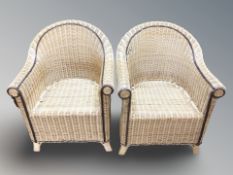 A pair of 20th century wicker armchairs, width 65 cm.