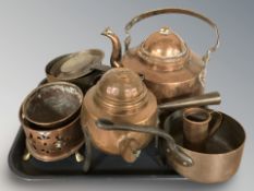 A group of copper cooking pans, teapot, mug and other vessels.