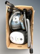 Two Nilfisk vacuum cleaners.