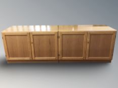 A pair of Danish oak double door low cabinets,