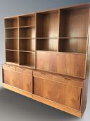 A 20th century Danish teak open bookcase/sideboard divided into four sections,