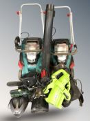Two Bosch electric lawn mowers and other electric garden tools.