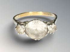A yellow gold dress ring set with three synthetic stones,
