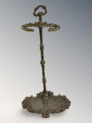 A cast brass stick stand, height 59 cm.