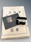 A pair of Royal Mint silver cuff links in the form of penny black stamps,