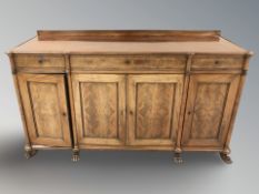 A 19th century mahogany four door sideboard on paw feet, 175 cm W x 57 cm D x 99 cm H.