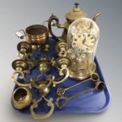 A Hermle quartz brass timepiece under dome, a pair of brass wall sconces,