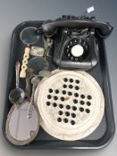 A Bakelite telephone, magnifying glasses, a solitaire board with marbles, a plated vesta case,