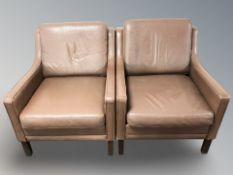 A pair of late 20th century Danish brown leather lounge armchairs, each 69 cm wide.