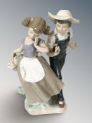 A Lladro figure group of a girl and boy, height 24 cm.