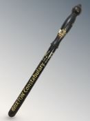 A turned wooden police truncheon with later Brixton Constabulary writing, length 57 cm.
