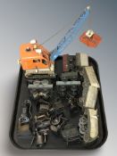 A group of vintage tin plate rolling stock, model crane, miniature models including desk fan,