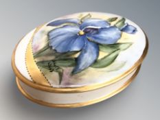 A Sheila Wood hand painted porcelain box and cover, width 19 cm.