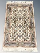A Tabriz rug, 101 cm x 59 cm.