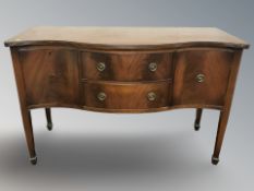 A reproduction mahogany serpentine-fronted sideboard,