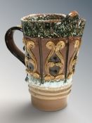 A decorative pottery jug, height 25 cm.