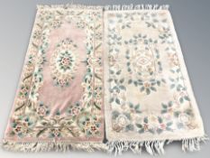 Two Chinese woolen rugs, each approximately 170 cm x 78 cm.