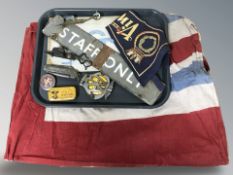 A group of flags, enameled staff only sign, candle snuffers, folding knife, AA badge, etc.