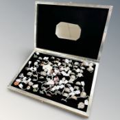 Approximately sixty-nine silver dress rings, including many decorative examples set with rubies,