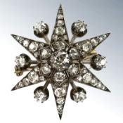 A Victorian old cut diamond star burst brooch, the six pointed star set with forty-six diamonds,
