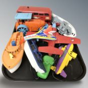 A group of plastic scale model boats, double decker bus, etc.