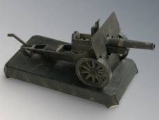 A Demley die cast metal table lighter in the form of a field gun, length 24 cm.