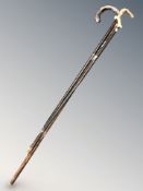 Two silver mounted walking sticks, plus one other.