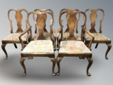A set of six Queen Anne style walnut dining chairs, comprising two carvers and four singles,